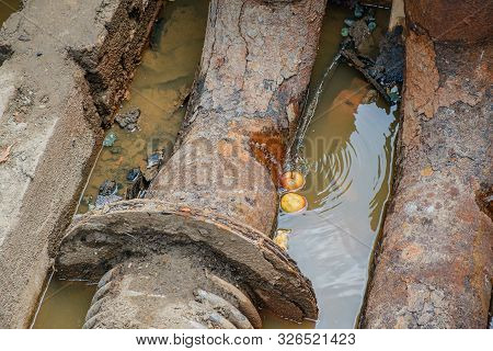Old Leaky Pipes In The Pit. Preparation For Pipe Replacement.