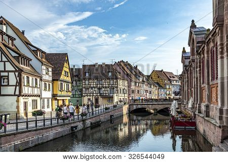 Colmar, France - June 4, 2019: Colorful Traditional French Houses On The Side Of River Lauch In Peti