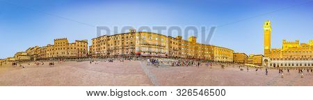Siena, Italy - August 9, 2019: Palazzo Publico And Piazza Del Campo In Siena. This Historic Center O