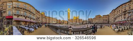 Siena, Italy - August 9, 2019: Palazzo Publico And Piazza Del Campo In Siena. This Historic Center O