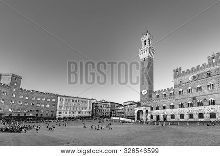 Siena, Italy - August 9, 2019: Palazzo Publico And Piazza Del Campo In Siena. This Historic Center O