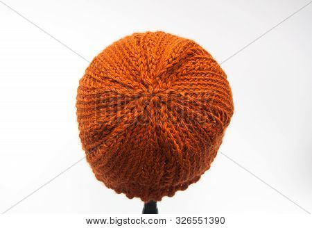 Back Of A Knitted Beanie Hat, Isolated On Light Background.  Fiber Art Shows The Detailed Stitches I