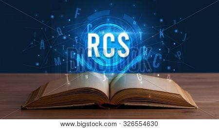 RCS inscription coming out from an open book, digital technology concept
