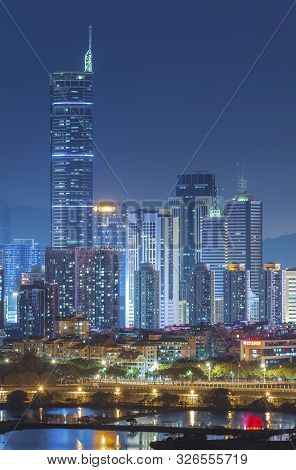 Skyline Of Shenzhen City, China At Twilight. Viewed From Hong Kong Border
