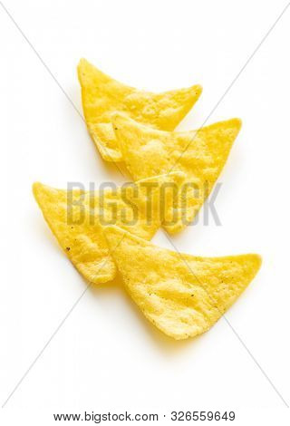 Corn nacho chips. Yellow tortilla chips isolated on white background.