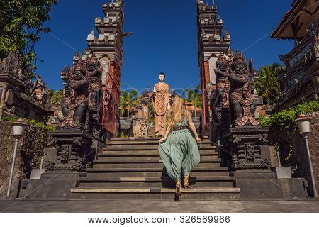 Young Woman Tourist In Budhist Temple Brahma Vihara Arama Banjar Bali, Indonesia