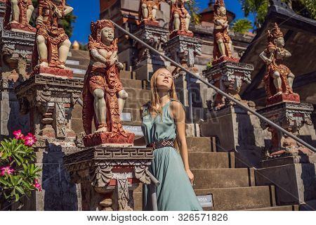 Young Woman Tourist In Budhist Temple Brahma Vihara Arama Banjar Bali, Indonesia