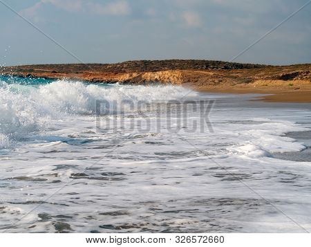 Foam And Waves In The Sea On A Sunny Day. Foam And Waves In The Sea. Powerful Waves Crushing For Bac