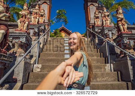 Young Woman Tourist In Budhist Temple Brahma Vihara Arama Banjar Bali, Indonesia Follow Me Concept