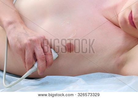 Doctor Making Echocardiography For Man Patient Heart By Using Ultrasound Equipment, Closeup View. Ca