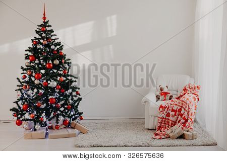 Christmas Tree In A White Room For Christmas With Gifts