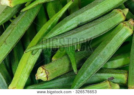 Whole Raw Green Okra Vegetable Food Background.