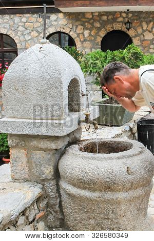 Washing Man In The Monastery Of St. Nahum, Lake Ohrid Macedonia
