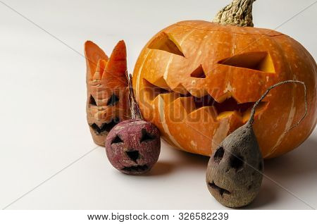 Jacks Head Of A Lantern Carved From Pumpkin For Halloween With Evil Vegetables
