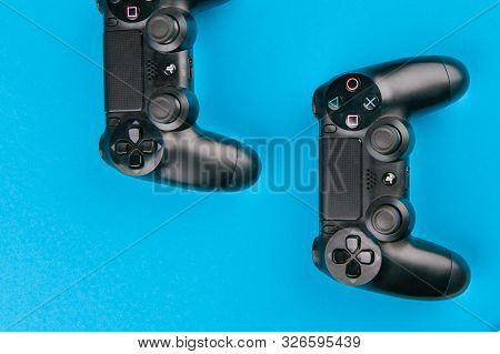 Game Joystick. Playstation. On A Blue Background Top View. The New Sony Dualshock 4 With Playstation