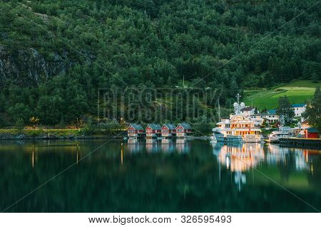 Flam, Norway. Famous Red Wooden Docks In Summer Evening. Small Tourist Town Of Flam On Western Side 