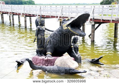 Phichit, Thailand - 1 October 2019 : Crocodile Statue Name Phaya Chalawan And Two Female Including T