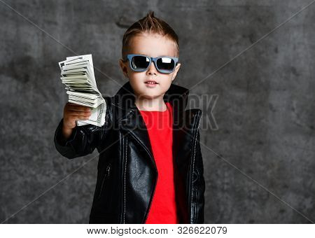 Self-confident Generous Rich Kid Boy Millionaire In Sunglasses, Leather Jacket And Red T-shirt Handi