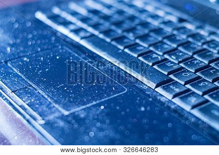 Close Up Of An Old Dusty Laptop Keyboard. Unhygienic Equipment In Home Or Office.