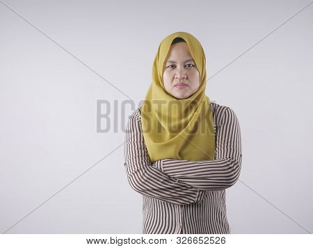 Portrait Of Angry Cynical Asian Muslim Woman With Suspicious Expression Looking At Camera, Mistrust 