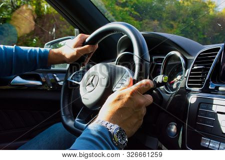 Mainz, Germany - October 03, 2019: Hands Of A Man In A Mercedes Gle 500 Cockpit While Driving.