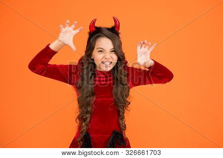 Halloween Costumes Designed After Supernatural Figures. Little Devil. Little Girl Red Horns Celebrat
