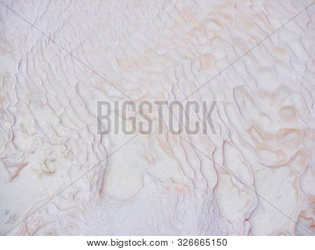 Undulatory Texture Of White Calcite Stalactites Covering A Cascade Of Terraced Baths In Pamukkale, T