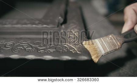Forge Workshop. The Product Is Artificially Aged. Gold Powder Painting Of Scratches, Roughness And S