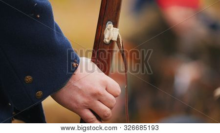Military Soldiers Hand Is Confidently Holging A Weapon