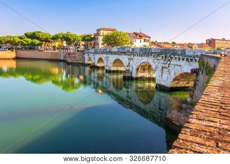 Rimini Cityscape. Beautiful City Landscape In Rimini With Famous Tiberius Bridge, Italy. Ponte Di Ti