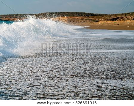 Foam And Waves In The Sea On A Sunny Day. Foam And Waves In The Sea. Powerful Waves Crushing For Bac