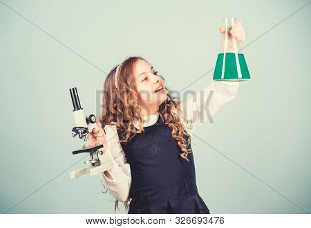 Child Study Bilogy Lesson. Discover Future. Small Girl Scientist With Testing Flask. Education And K