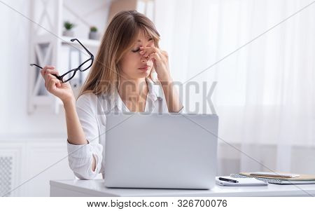 Eye Strain. Overworked Office Girl Massaging Nosebridge Having Eyesight Problem Sitting At Laptop At
