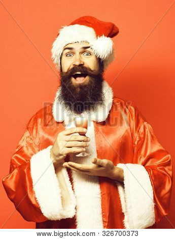 Handsome Bearded Santa Claus Man With Long Beard On Smilingface Holding Glass Of Alcoholic Shot On H