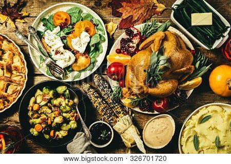 Selection Of Traditional Thanksgiving Food - Turkey, Mashed Patatoes, Green Beans, Apple Pie On Rust