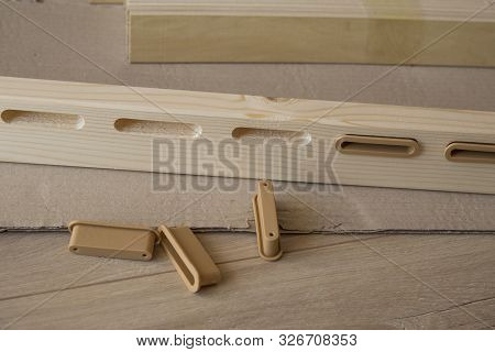 Furniture Assembly Parts And Tools For Self Assembly Furniture, On The Floor.
