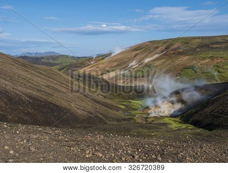 Landmannalaugar Colorful Rhyolit Mountains With Steam From Hot Spring On Famous Laugavegur Trek. Fja