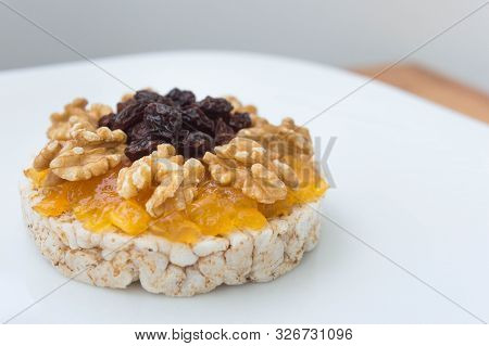 Rice Biscuit With Cream And Sweet Papaya, Nuts And Raisins.