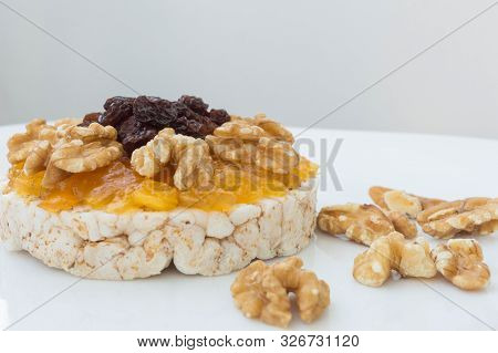 Rice Biscuit With Cream And Sweet Papaya, Nuts And Raisins.