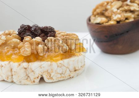 Rice Biscuit With Cream And Sweet Papaya, Nuts And Raisins.