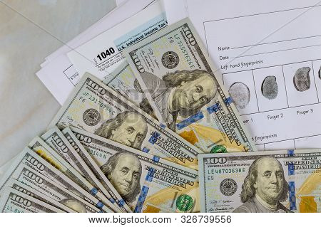 1040 Individual Tax Return Form And Dollar Bils Fingerprint Record Sheet, Criminal Investigation