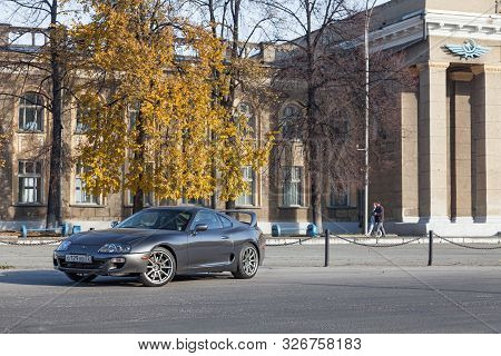 Novosibirsk, Russia - 10.09.2019: A Rare Japanese Sports Car In The Back Of A Gray Toyota Supra Coup