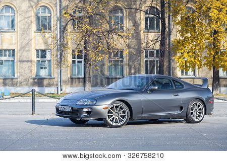 Novosibirsk, Russia - 10.09.2019: A Very Rare Japanese Sports Car In The Back Of A Toyota Supra Coup