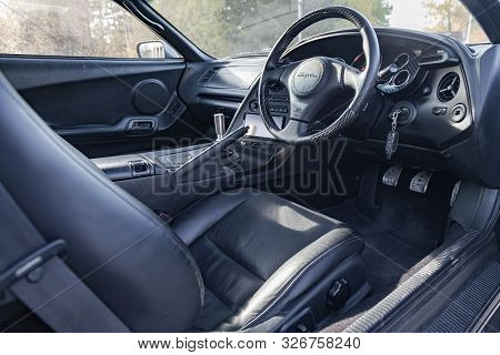 Novosibirsk, Russia - 10.09.2019: Interior Of A Rare Japanese Sports Car In The Back Of A Gray Toyot