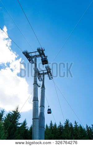 Sinaia, Prahova, Romania - June 29, 2019: View Of The Big Steel Pillars Of The  Car Gondola In Sinai