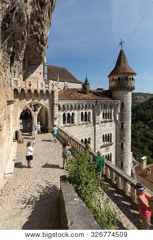 Rocamadour, France - September 3, 2018: Stone Walls Of Historic Basilica Of St-sauveur Blend Into Th