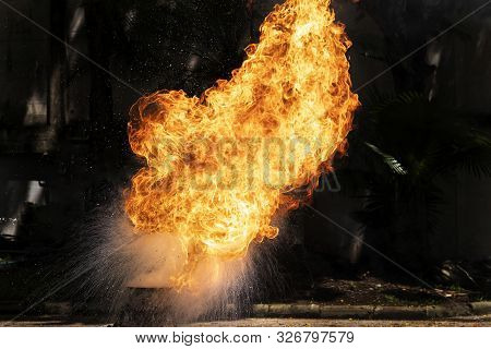 Flames Caused By The Explosion Of The Oil. Demonstration Of Water On Oil Fire.