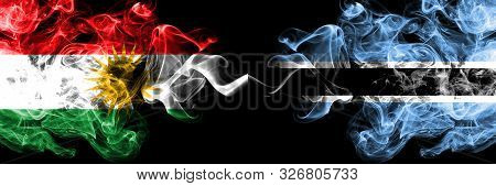 Kurdistan Vs Botswana, Botswanan Smoke Flags Placed Side By Side. Thick Colored Silky Smoke Flags Of