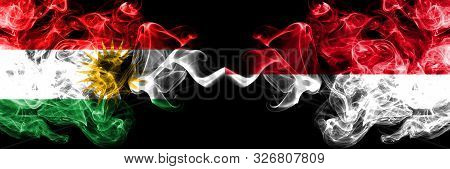 Kurdistan Vs Monaco, Monacan Smoke Flags Placed Side By Side. Thick Colored Silky Smoke Flags Of Kur