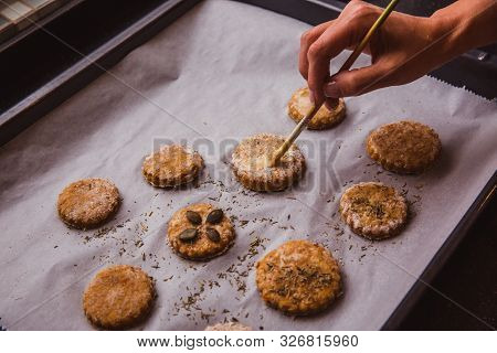 Woman Glazing Scones With Brush Ready To Go In The Oven